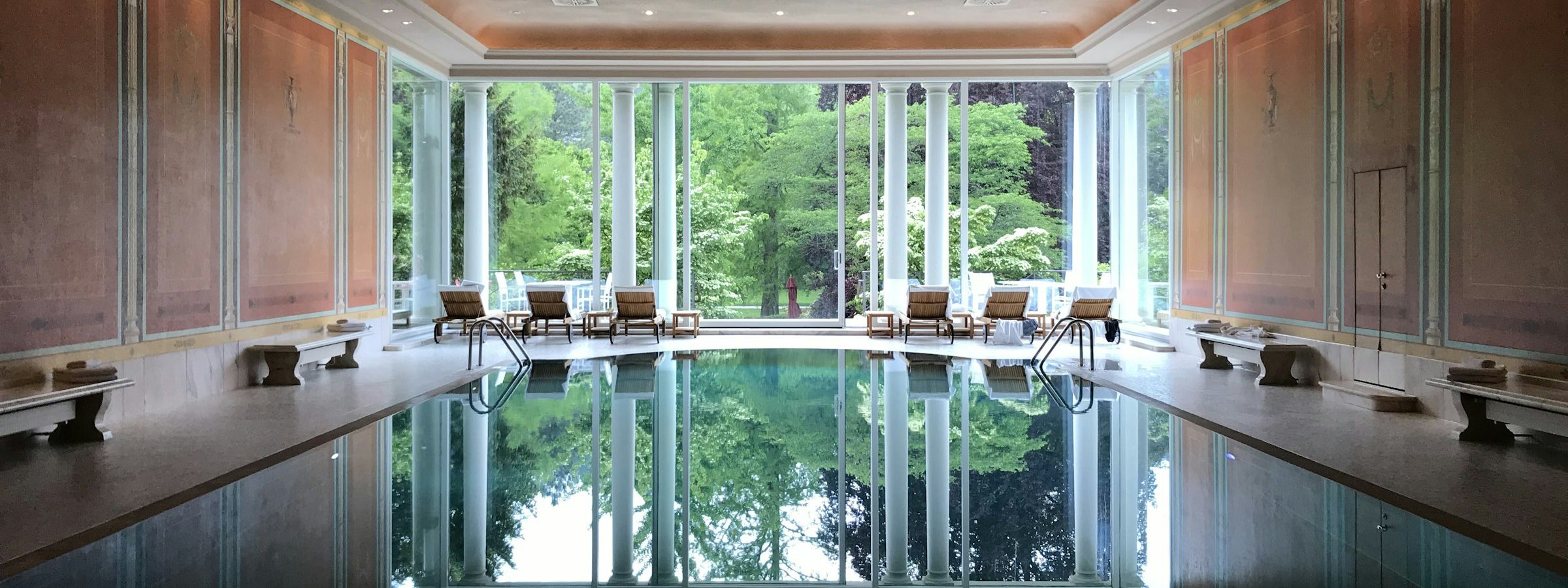 Indoor spa pool with a garden view